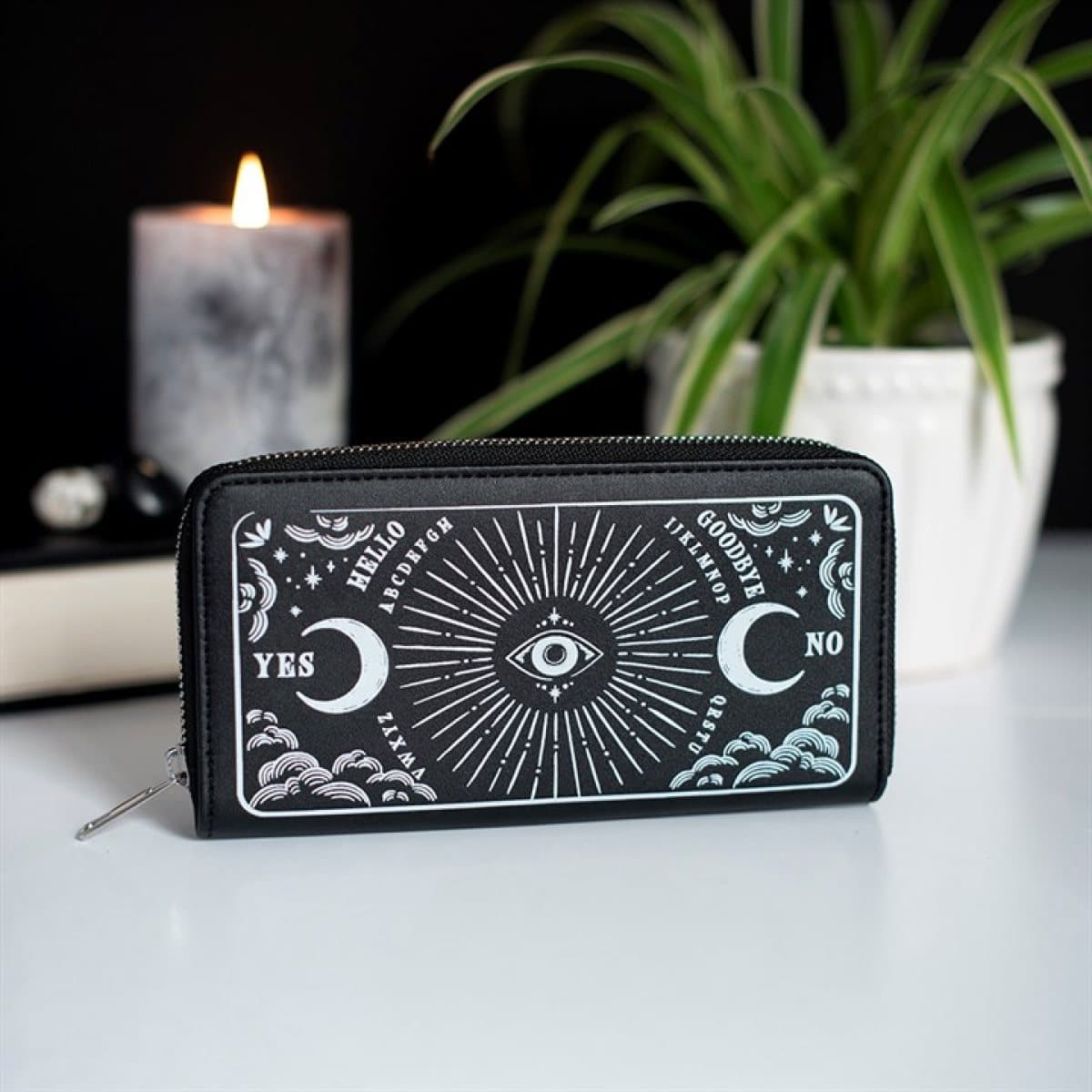 Black faux leather zippered wallet with moons, clouds and an all-seeing eye