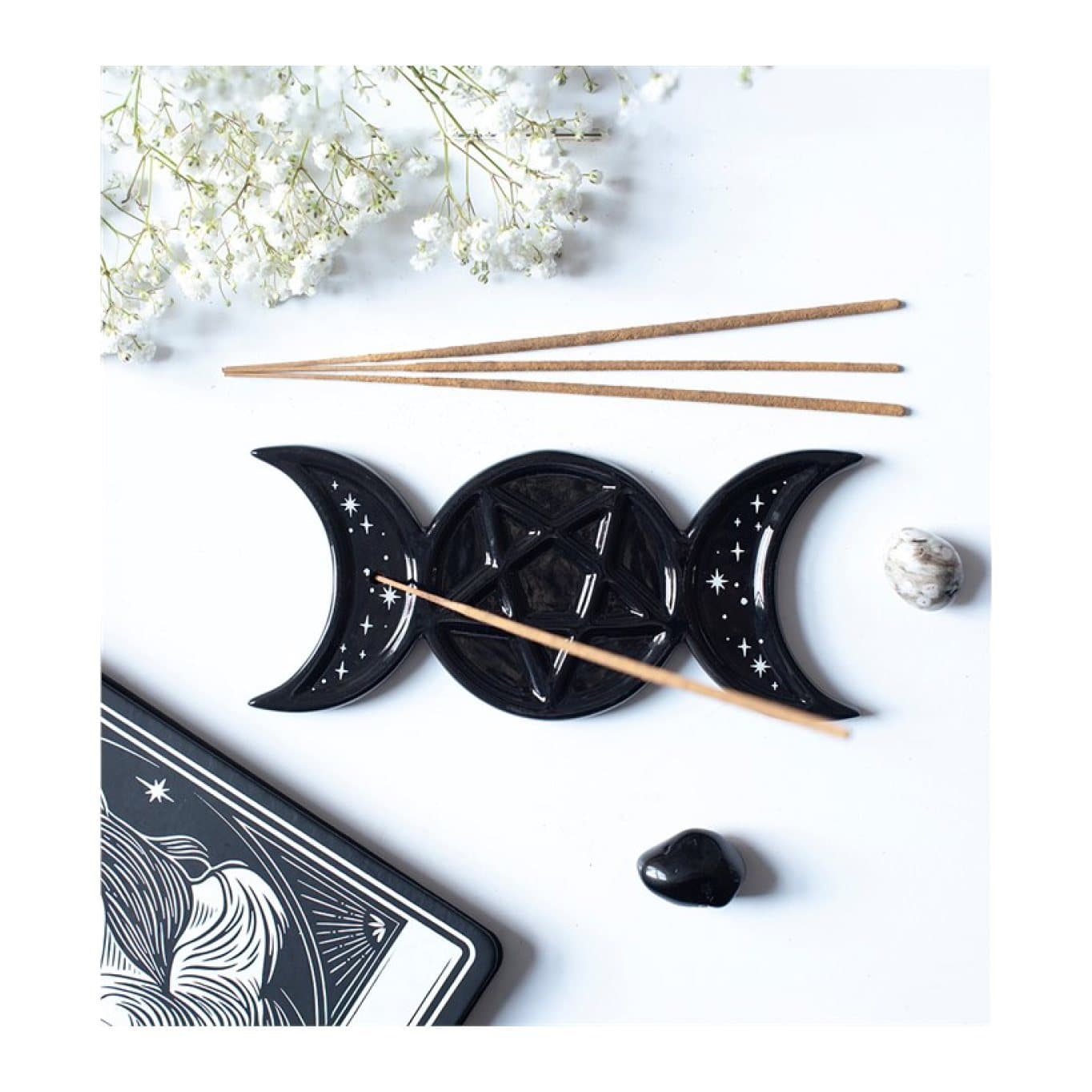 Glossy black triple moon incense stick holder with white stars and a pentagram