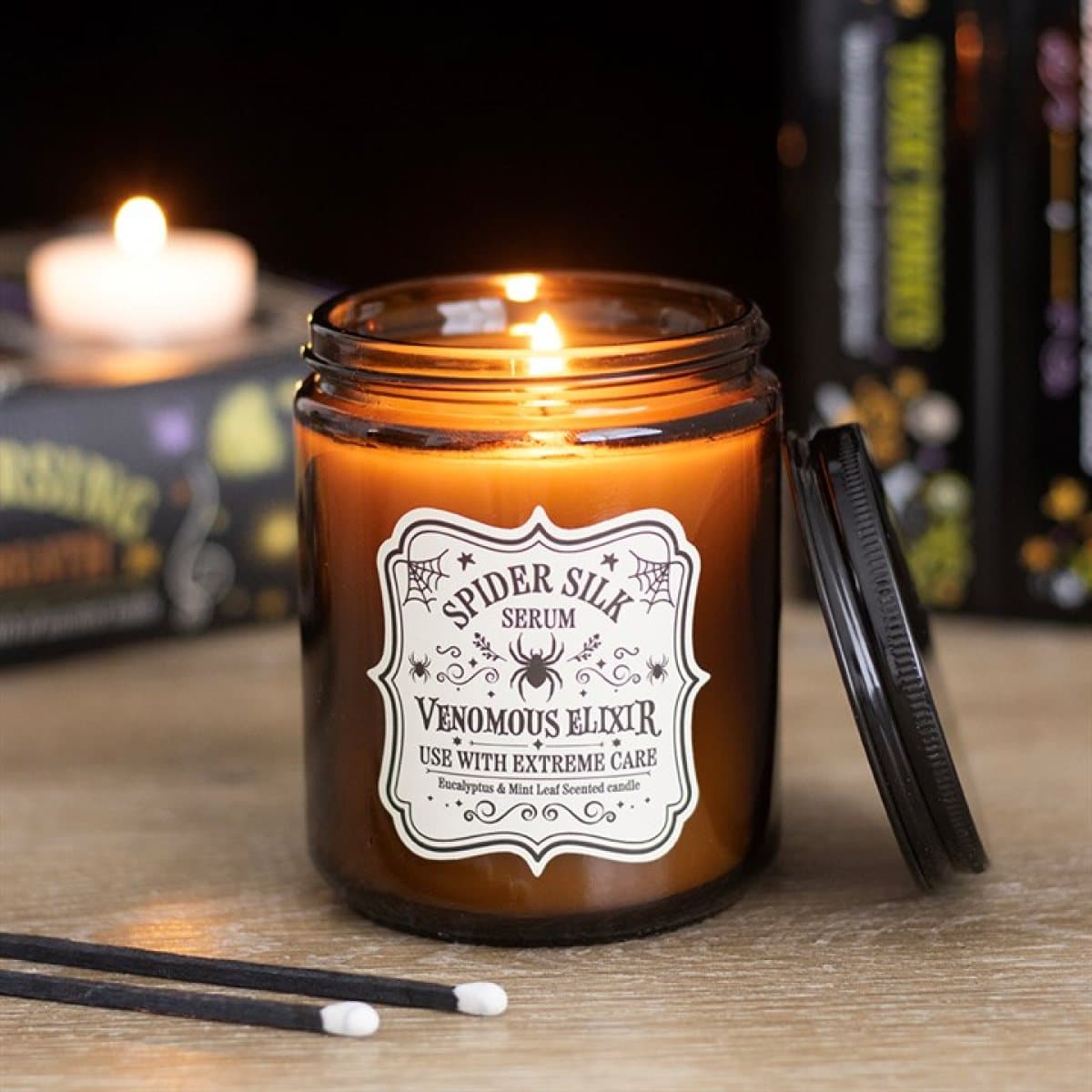 Spider Silk Serum candle in an apothecary-style glass jar