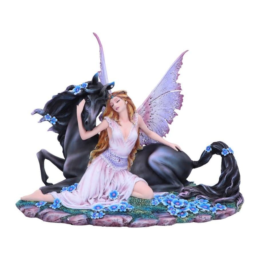 Resin fairy in a pink gown beside a black horse on a mossy rock with blue flowers