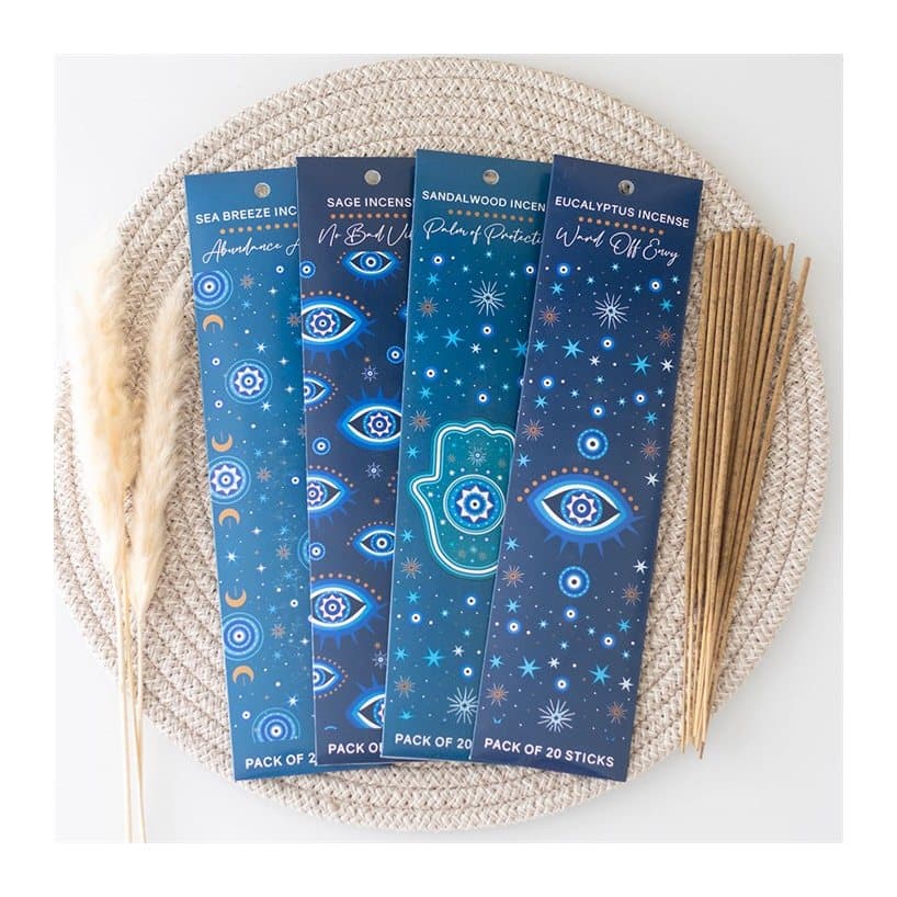 Four packs of incense sticks decorated with all seeing eyes, Hamsa hands and stars