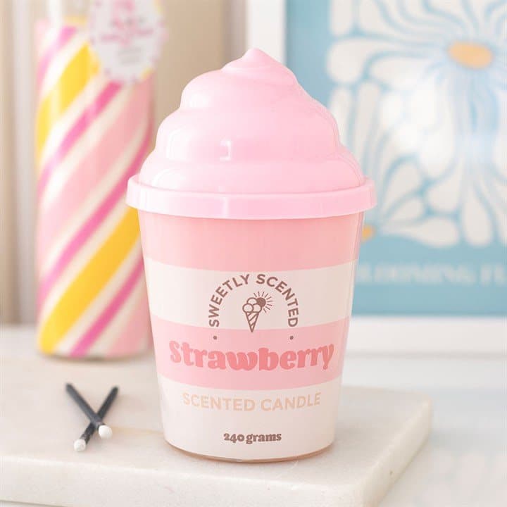 Soft pink strawberry ice cream candle with swirled lid in a white cardboard box