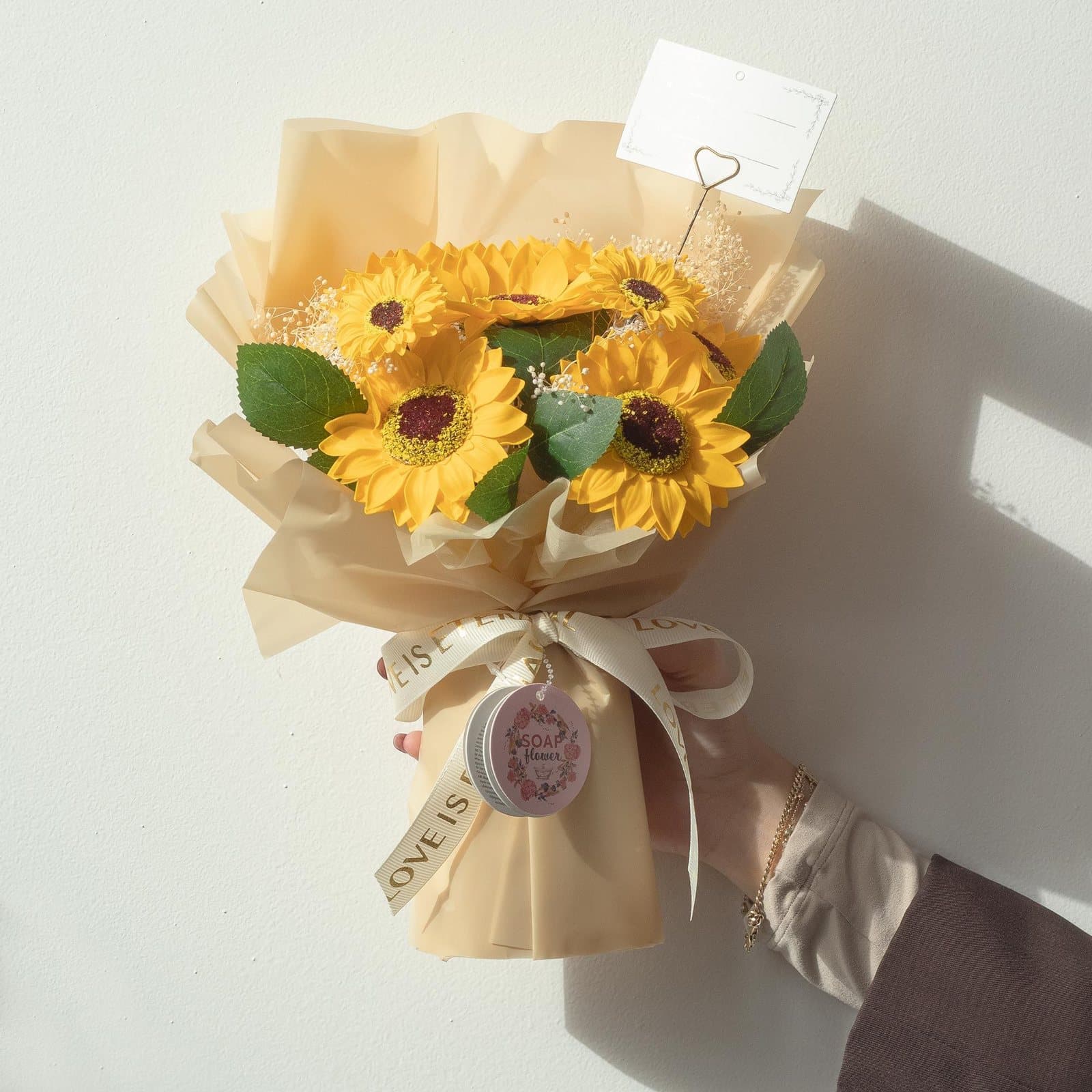 Large soap sunflower bouquet in golden paper with ribbon and gift card