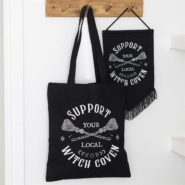 Black tote bag with Support Your Local Witch Coven text and a broomstick