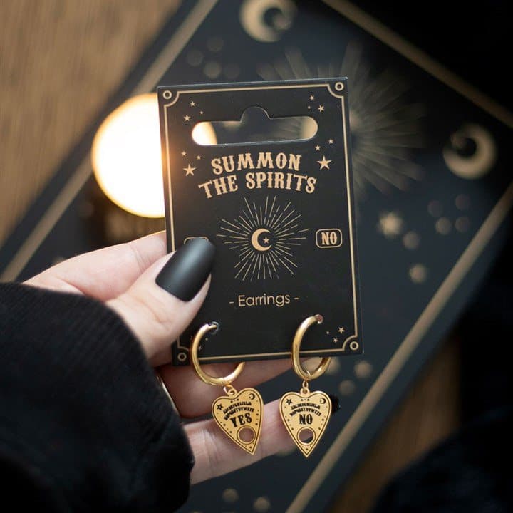 Gold-tone talking board planchette earrings dangling from small hoops