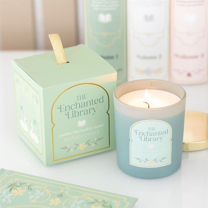 Jar candle in green illustrated packaging with a gold-coloured lid