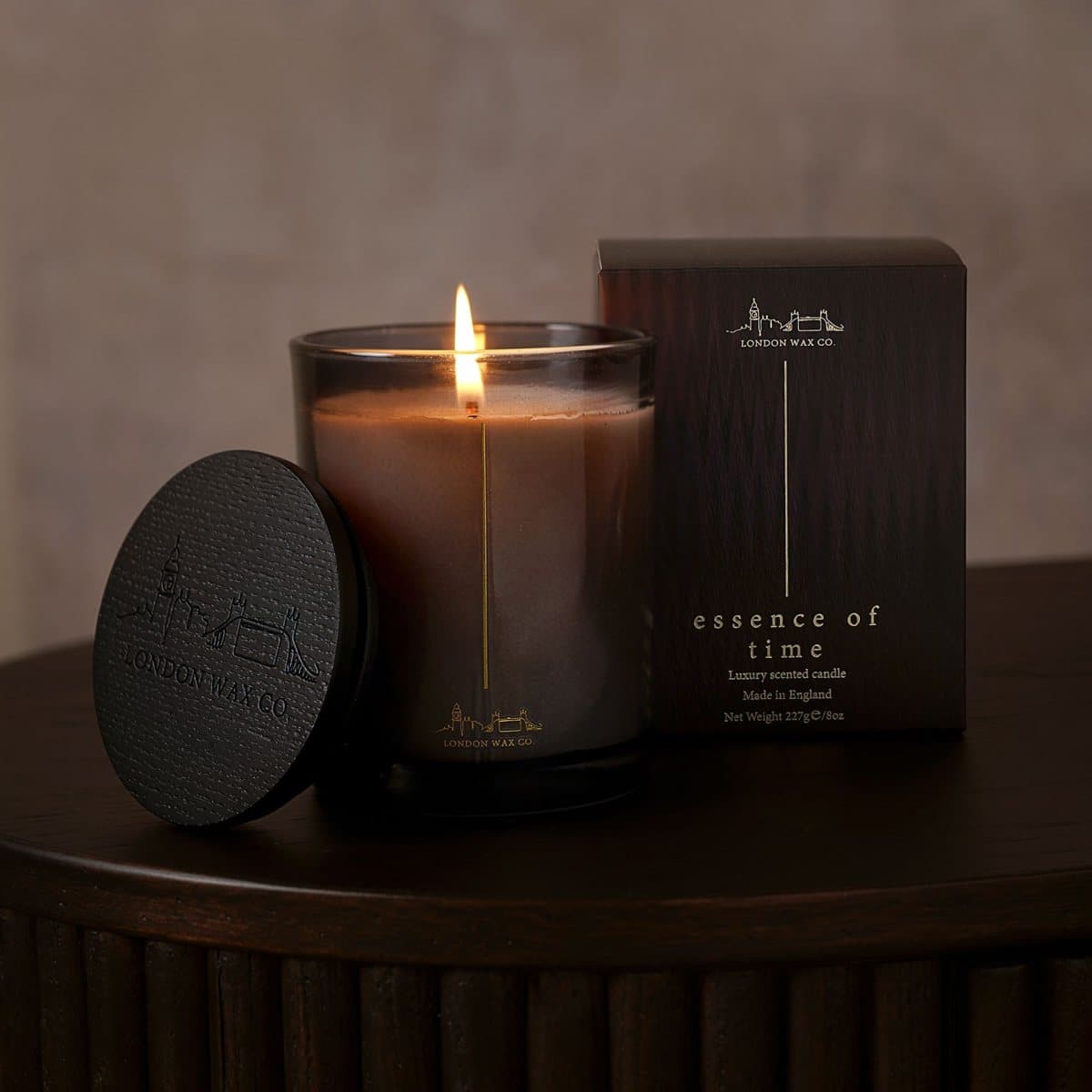 Essence Of Time candle in a sleek glass jar