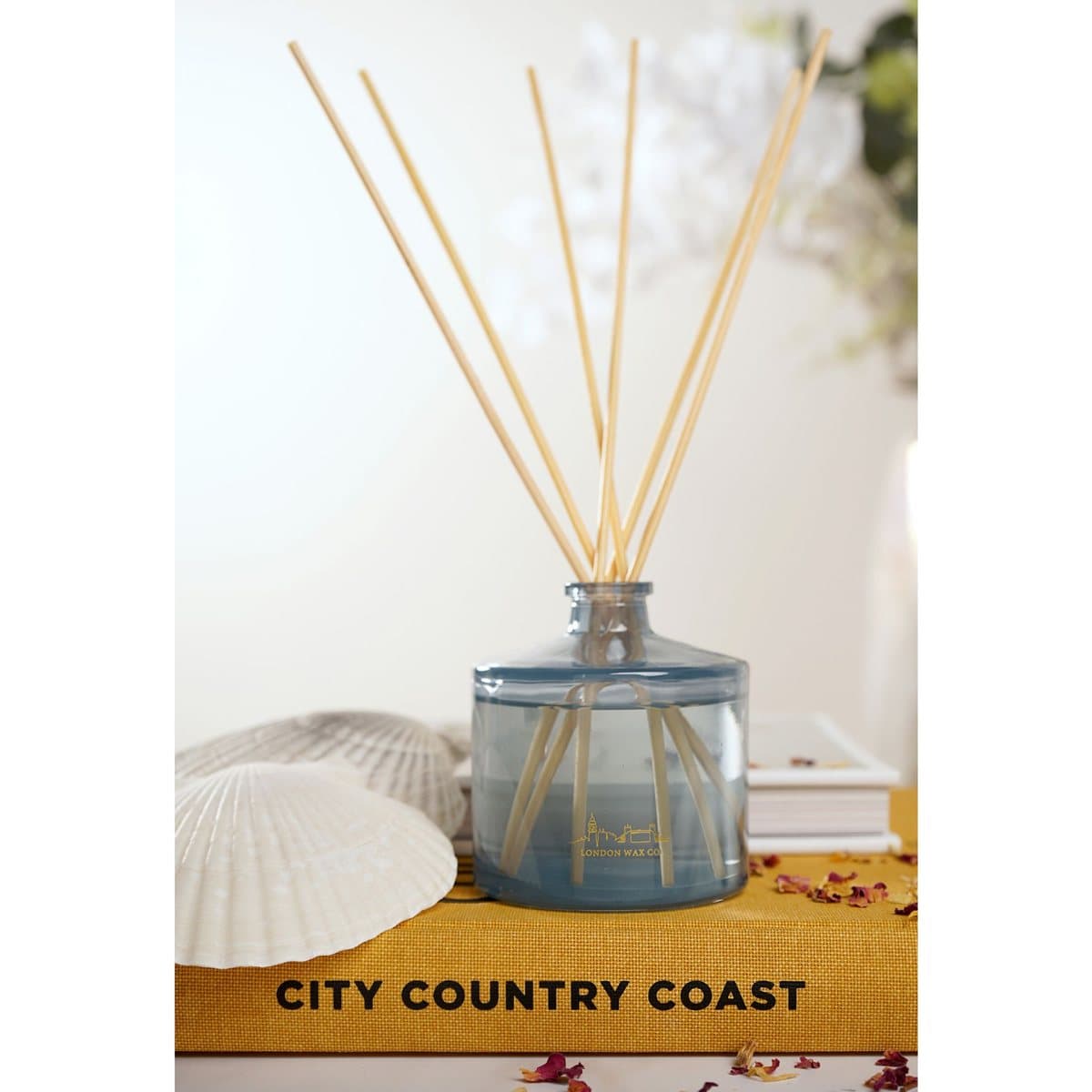 Seashore Stroll glass reed diffuser bottle with wooden reed sticks and floral box
