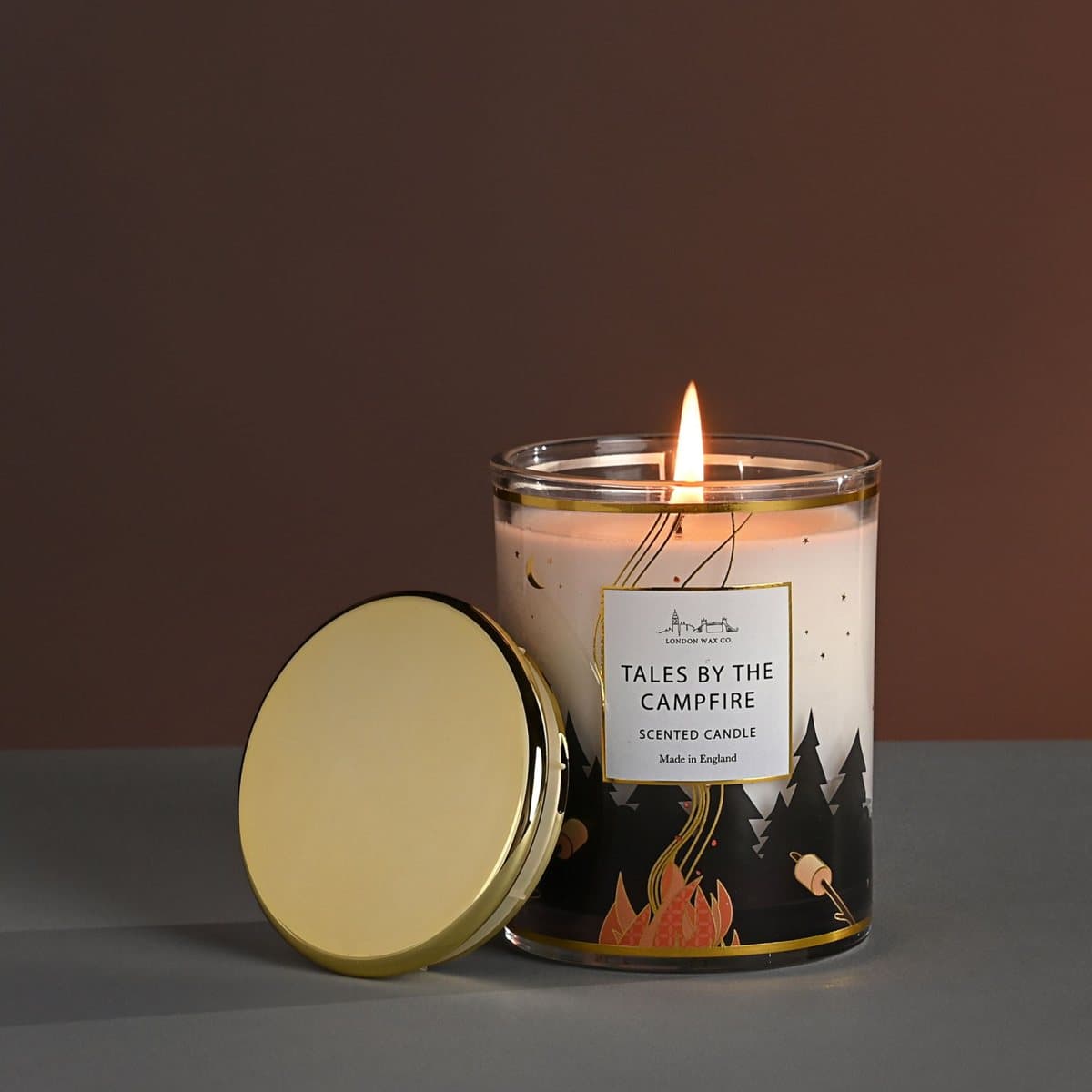 Tales By The Campfire candle in an illustrated glass jar