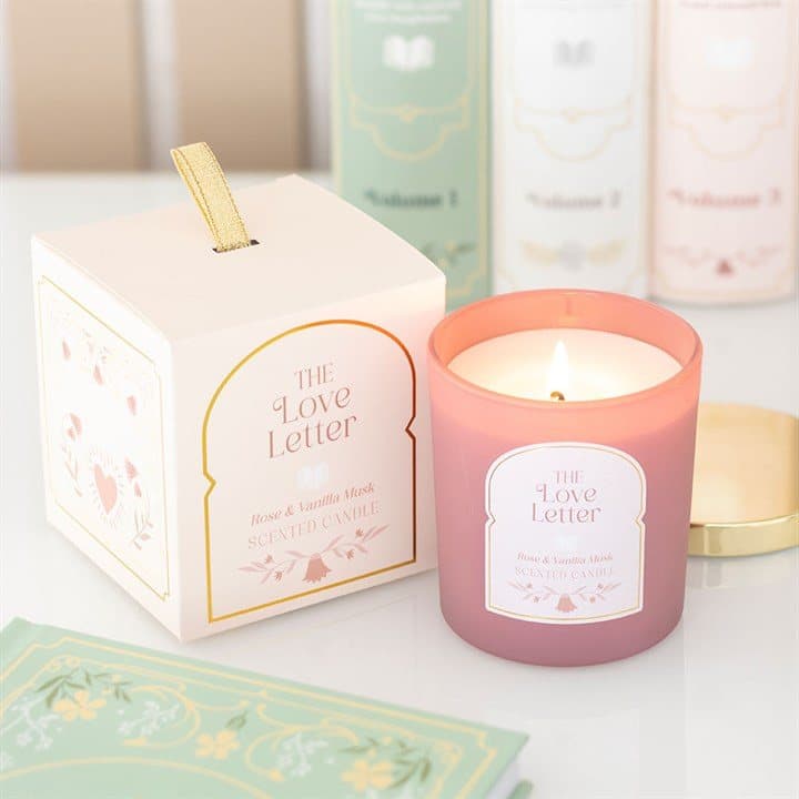 Rose and vanilla musk jar candle in pink with a gold-coloured lid