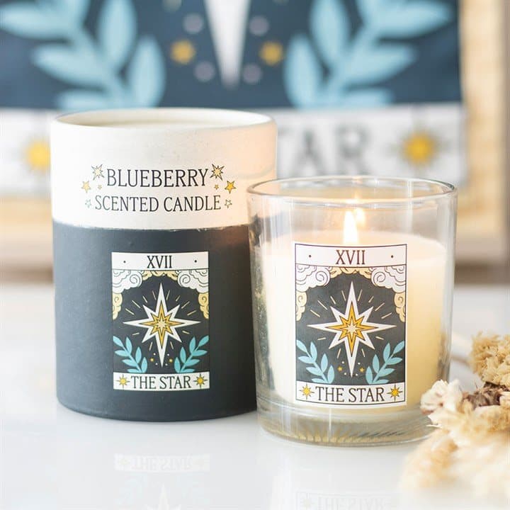Blueberry-scented candle with a blue The Star tarot card design