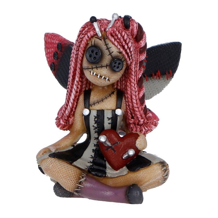 Fairy-like voodoo doll figurine with button eyes and stitched-together wings