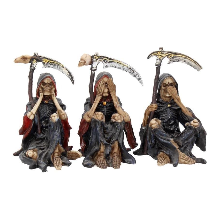 Three skeleton figurines on rocky mounds covering eyes, ears and mouth