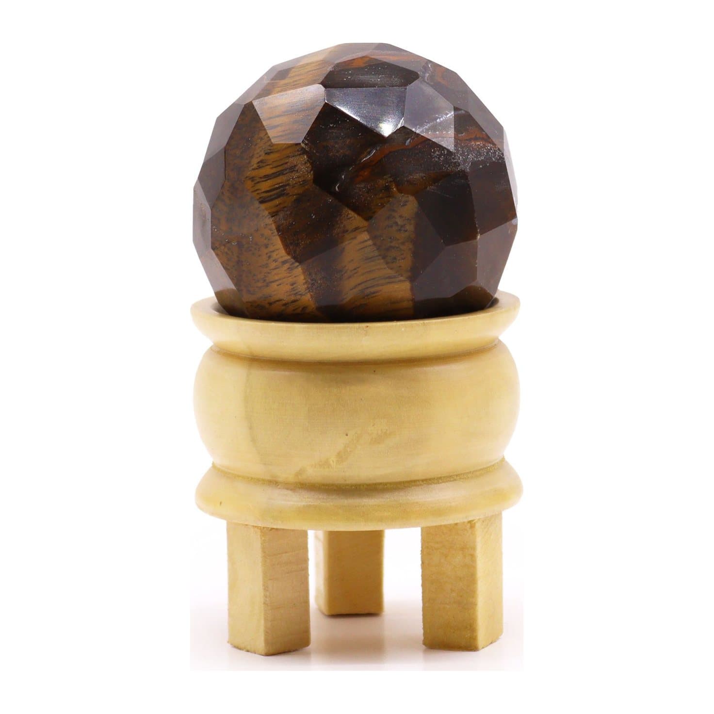 Faceted tiger's eye sphere on a light brown wooden stand