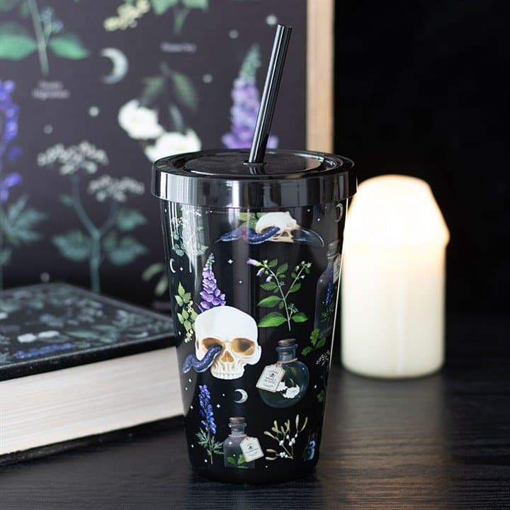 Plastic tumbler with straw and a skull and venomous plants print
