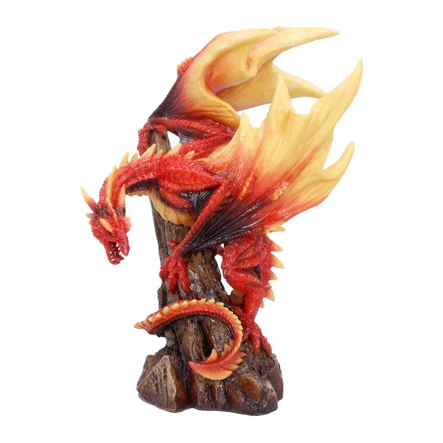 Red and orange dragon figurine perched on a spiked rock