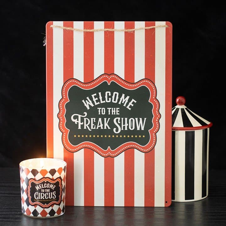 Metal hanging sign with circus stripes and Welcome to the Freak Show text