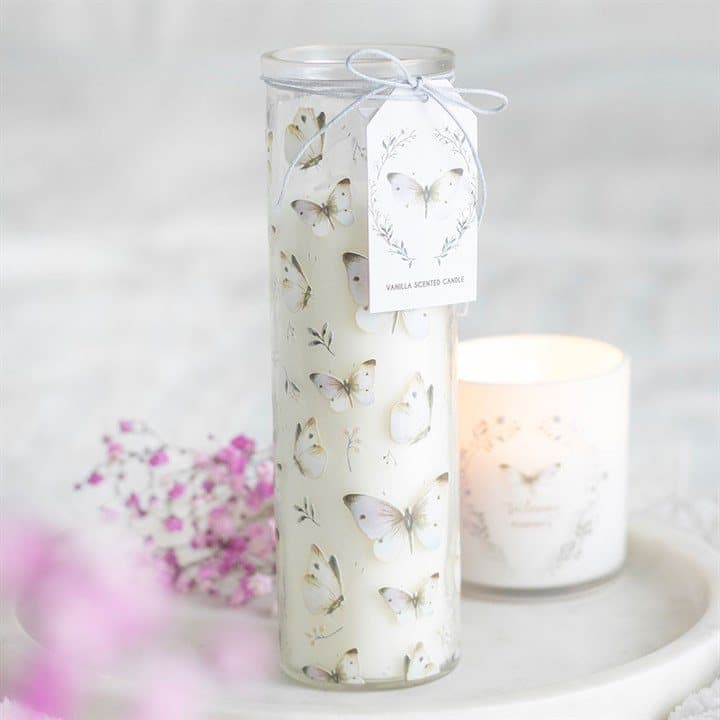 White tube candle covered in a butterfly print