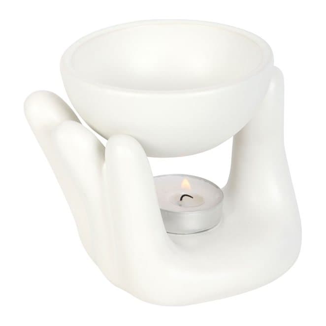 White ceramic oil burner in the shape of a hand