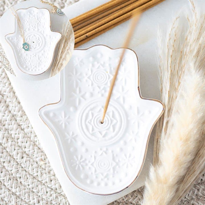 White ceramic incense holder shaped like the Hand of Hamsa