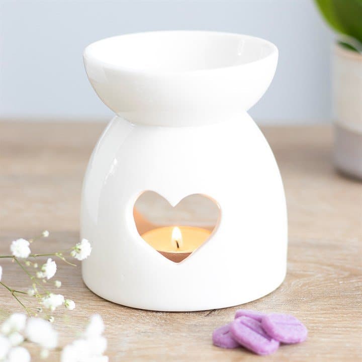 White ceramic oil burner with a heart cut out
