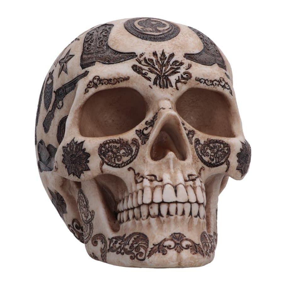 Resin skull decorated with rifles, cacti, cowboy hats and boots