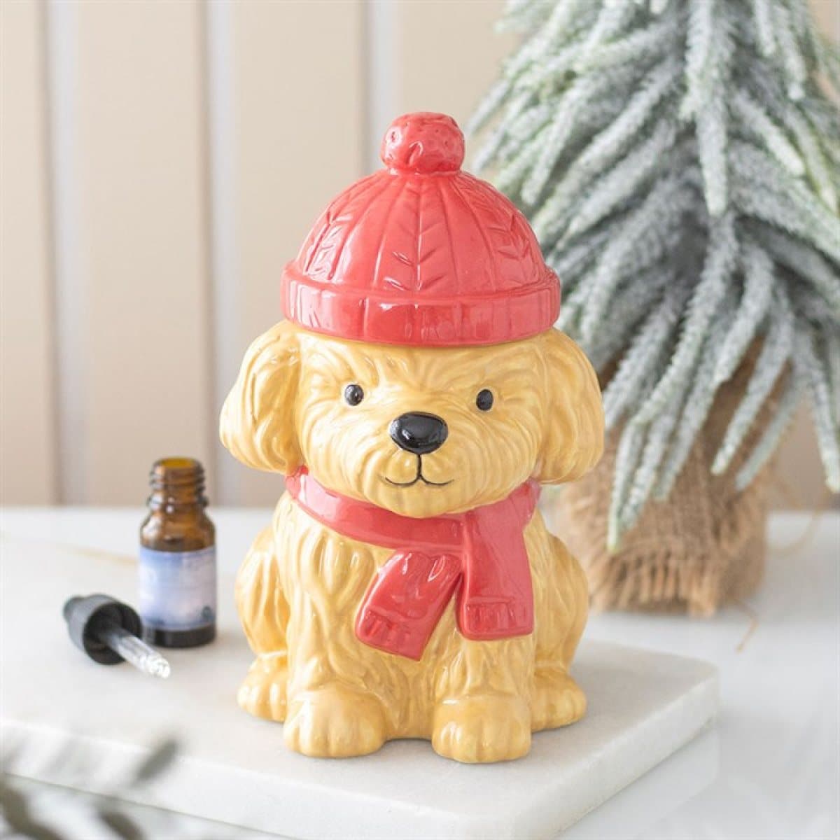 Ceramic puppy oil burner with red scarf and bobble hat lid