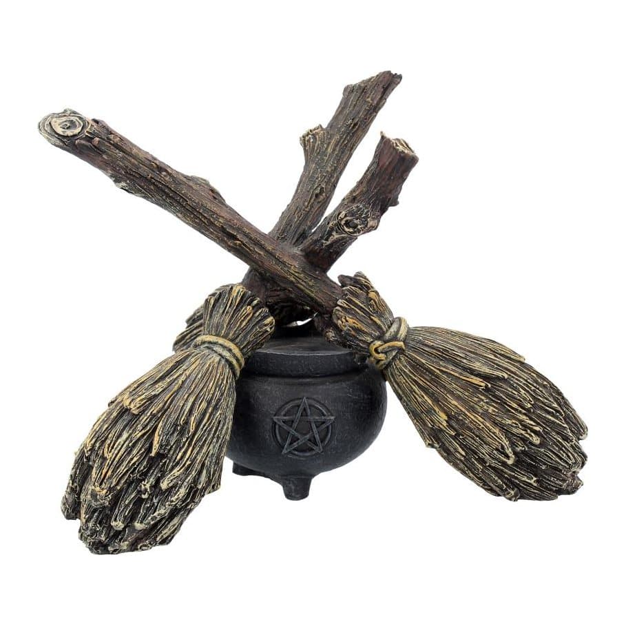 Three witch broomsticks lashed into a tripod on a pentagram cauldron