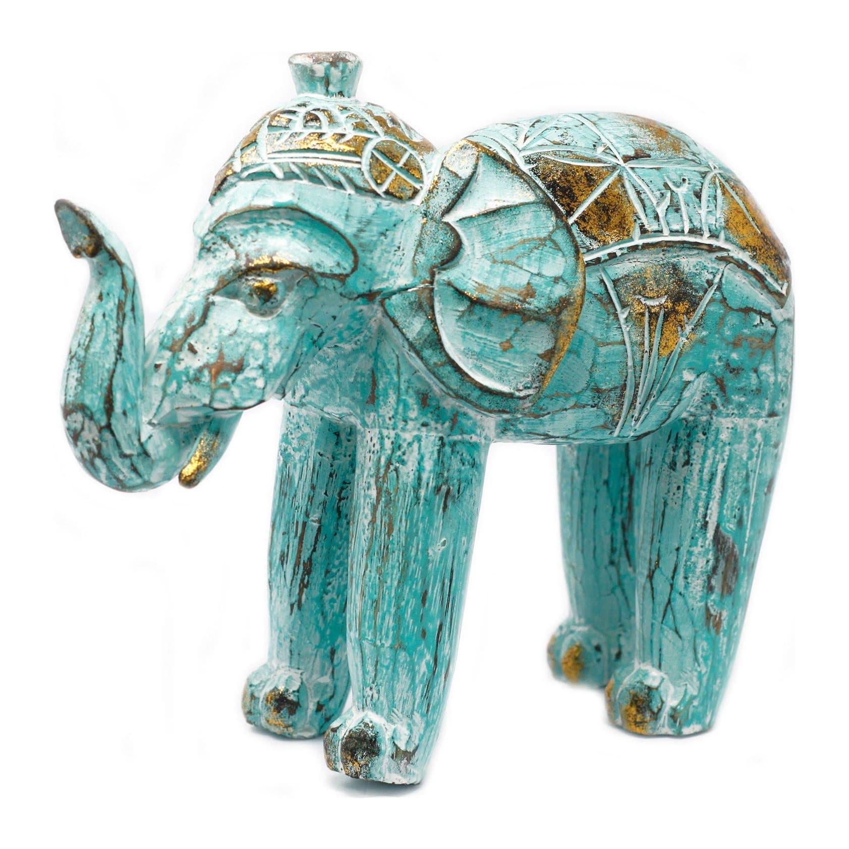 Hand carved wooden elephant painted white and turquoise with gold glitter