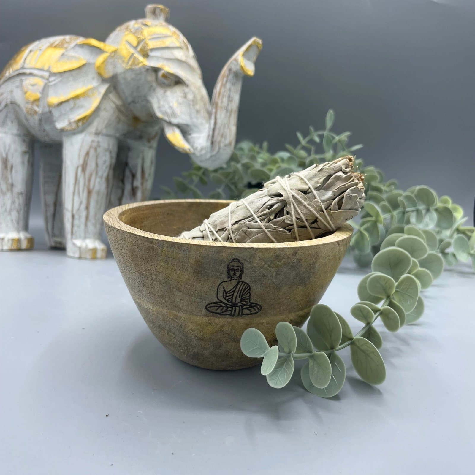 Wooden mango wood ritual offerings bowl with a Buddha design