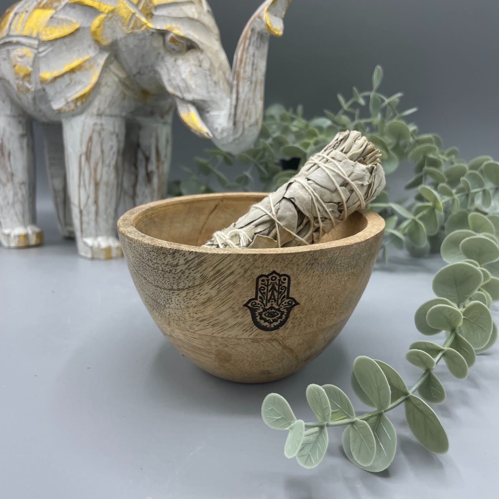 Mango wood bowl with a Hamsa design for ritual offerings