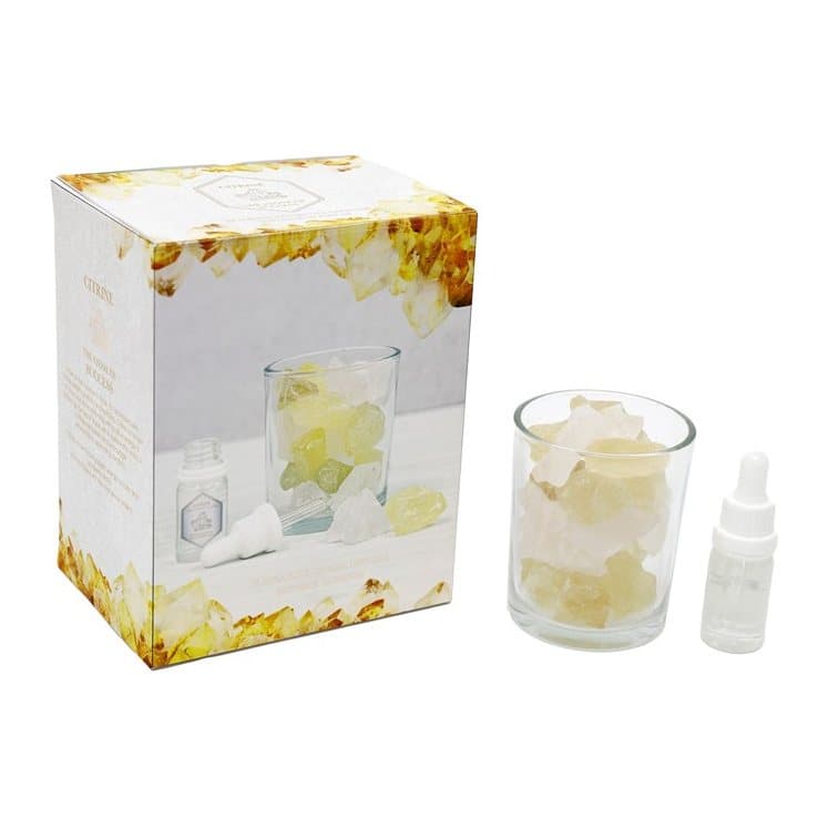 Glass jar of yellow citrine crystals with fragrance oil