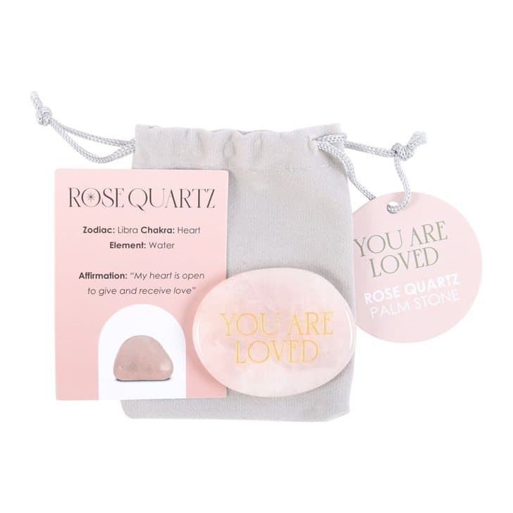 Rose quartz palm stone engraved with gold-toned 'you are loved' text
