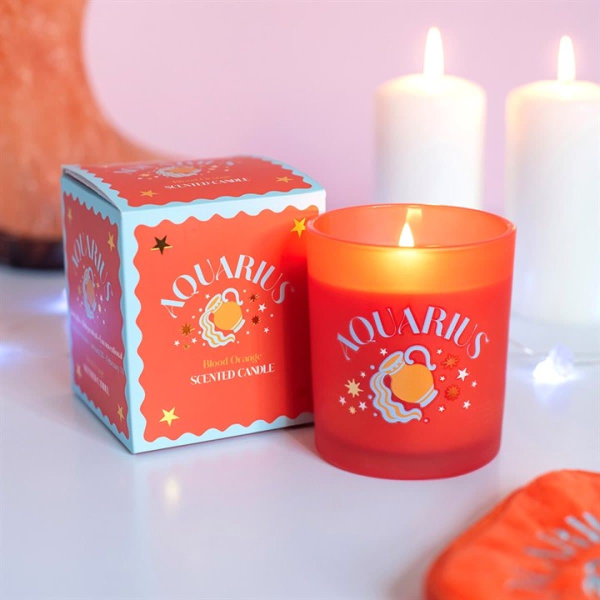Aquarius blood orange candle with a colourful zodiac design