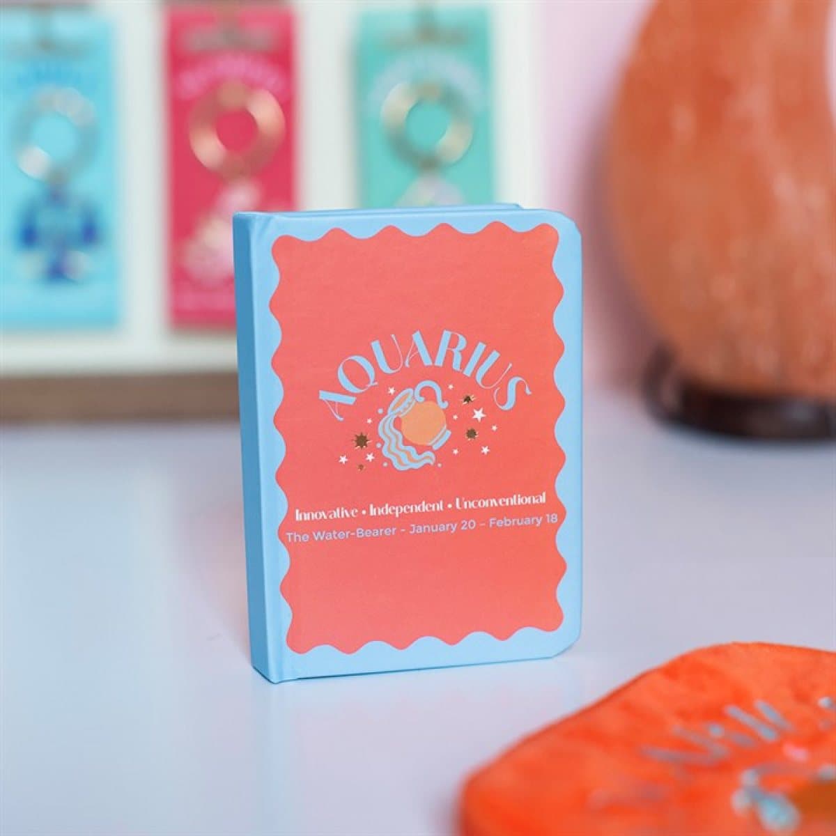 Mini A7 Aquarius notebook with colourful water bearer design