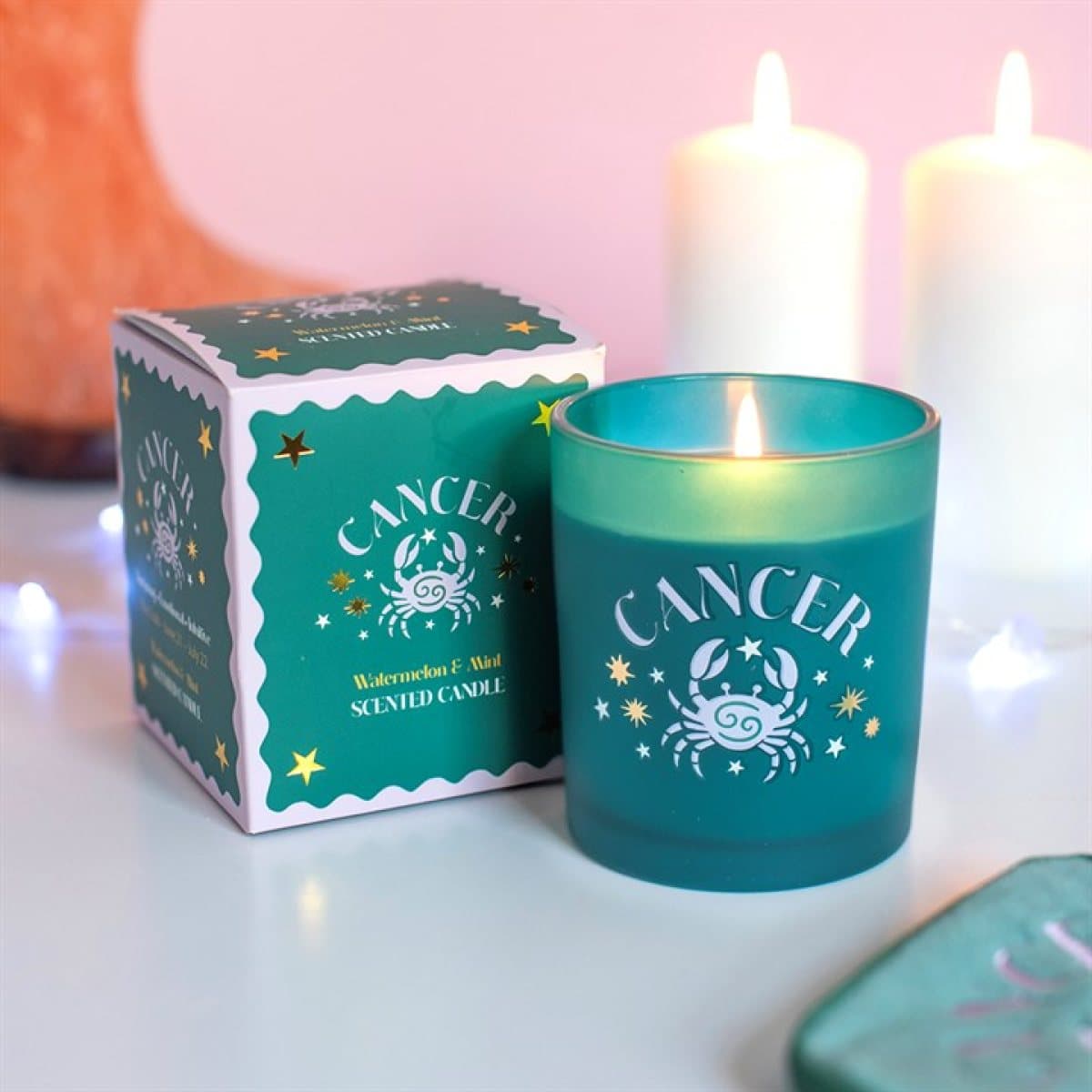 Colourful Cancer zodiac candle with a crab-inspired design in a colour cardboard box
